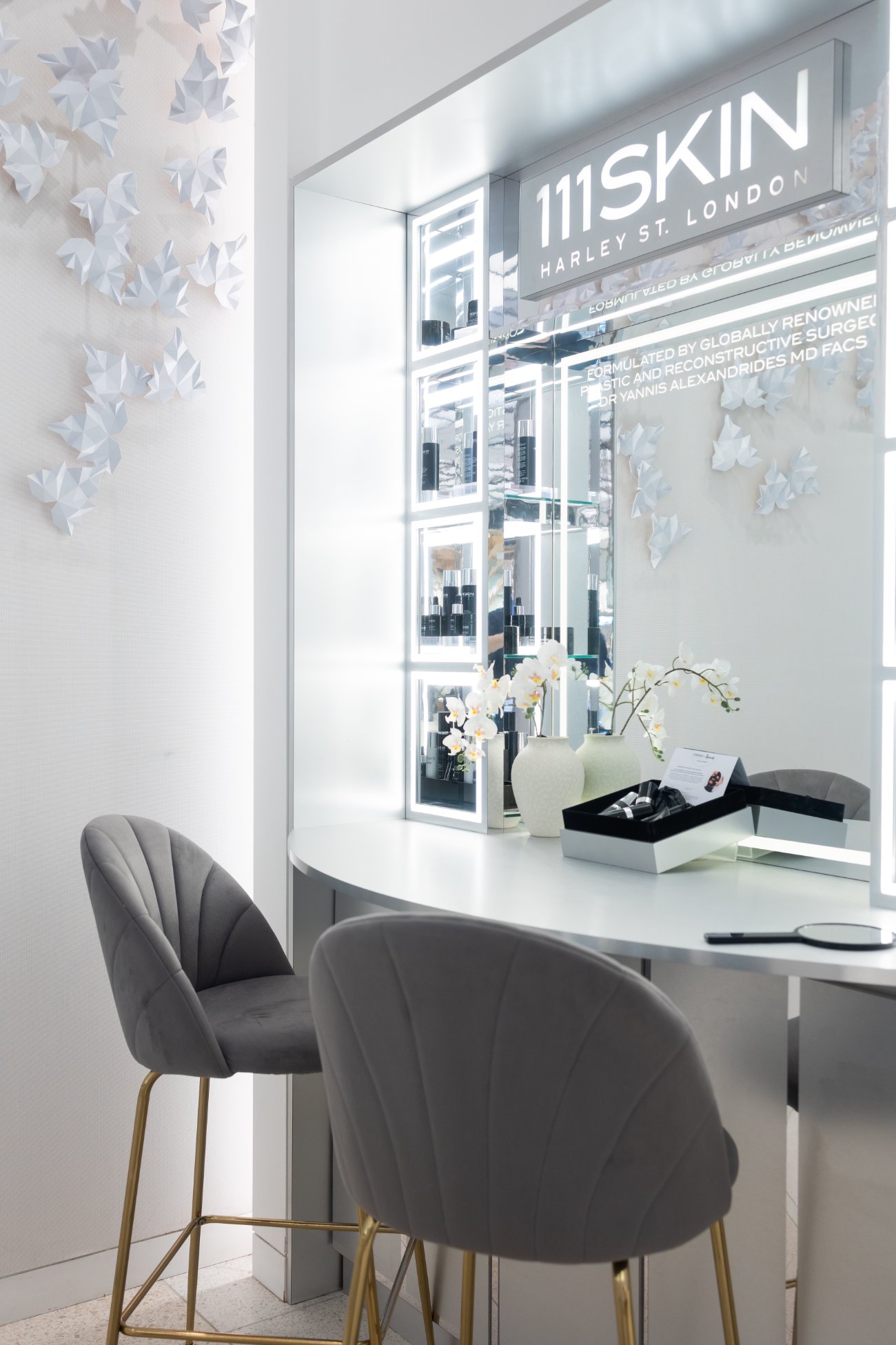 111SKIN consultation nook beneath the porcelain butterfly wall