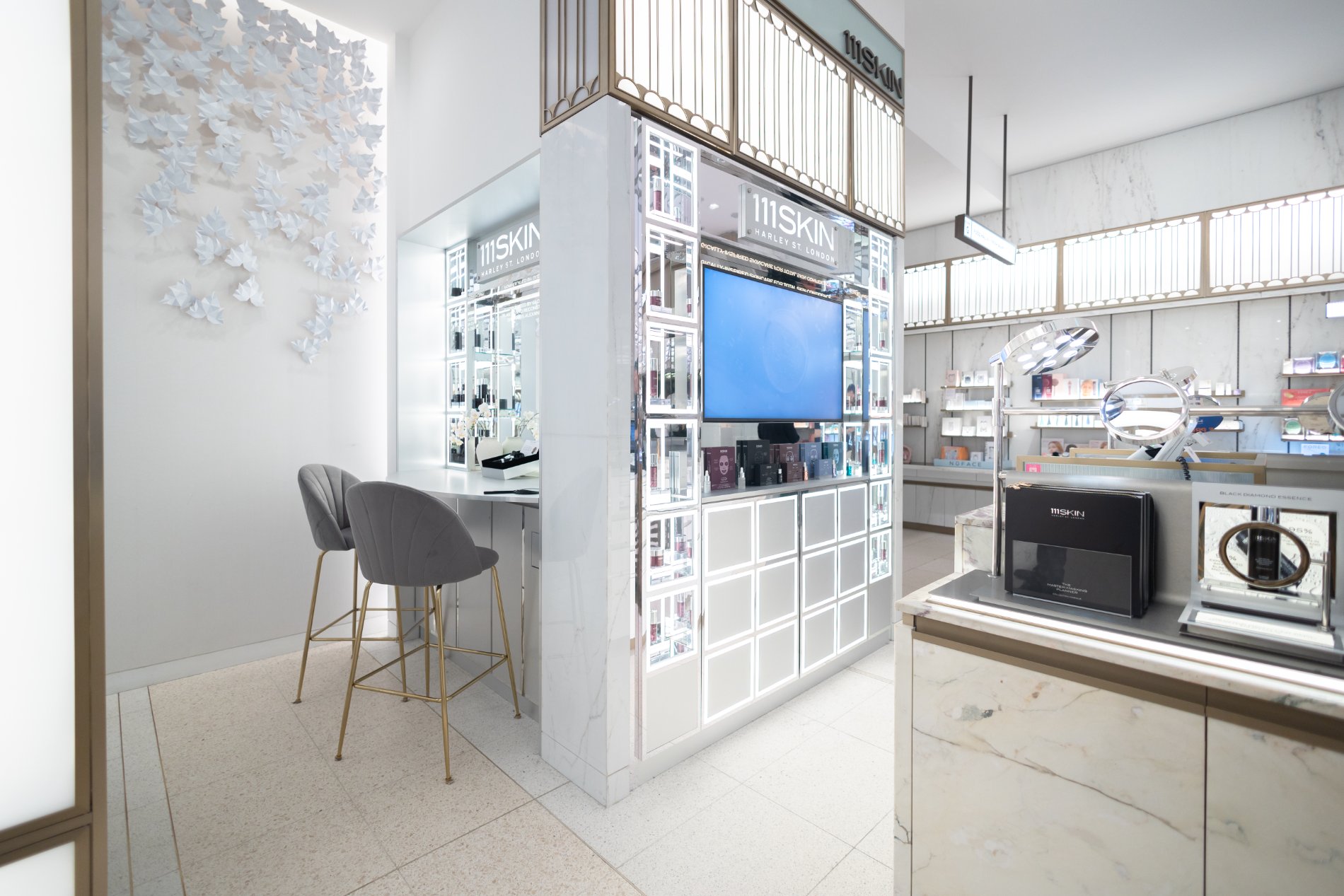 111SKIN counter and consultation nook beneath the butterfly wall