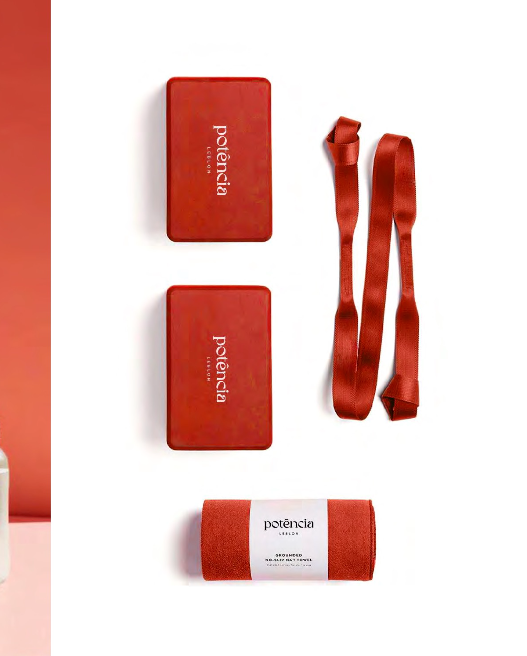 Red Pilates blocks, strap and mat towel with the potência mark