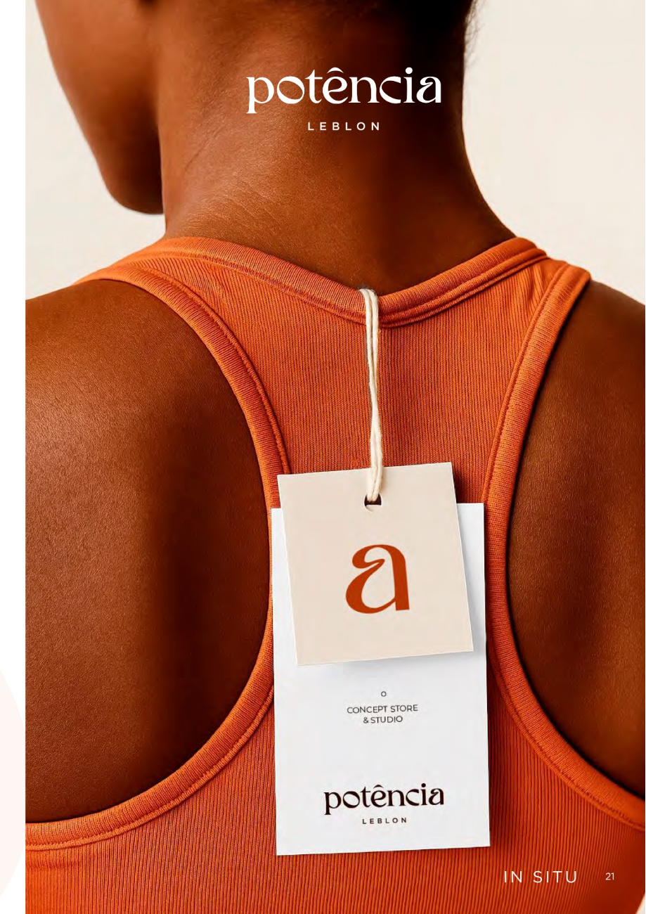 Orange tank top with a monogram swing tag